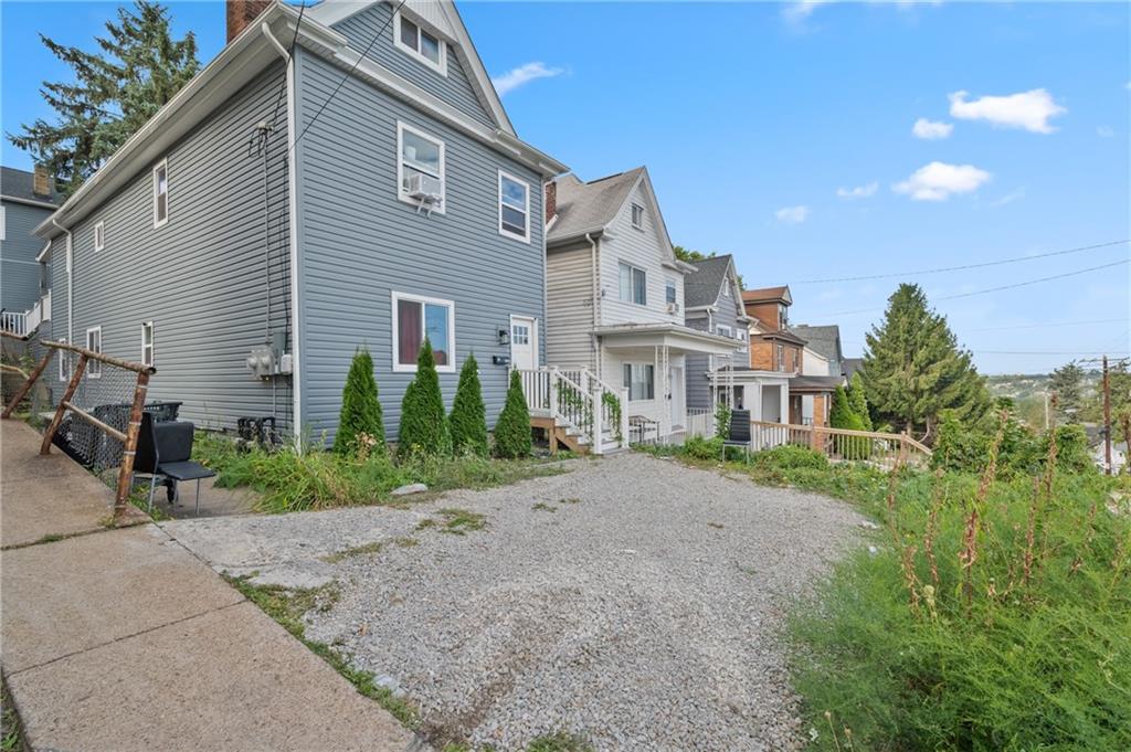 11 Maytide Street Pittsburgh, PA 15227 - Photo 4 of 8 a front view of a house with a yard and garage