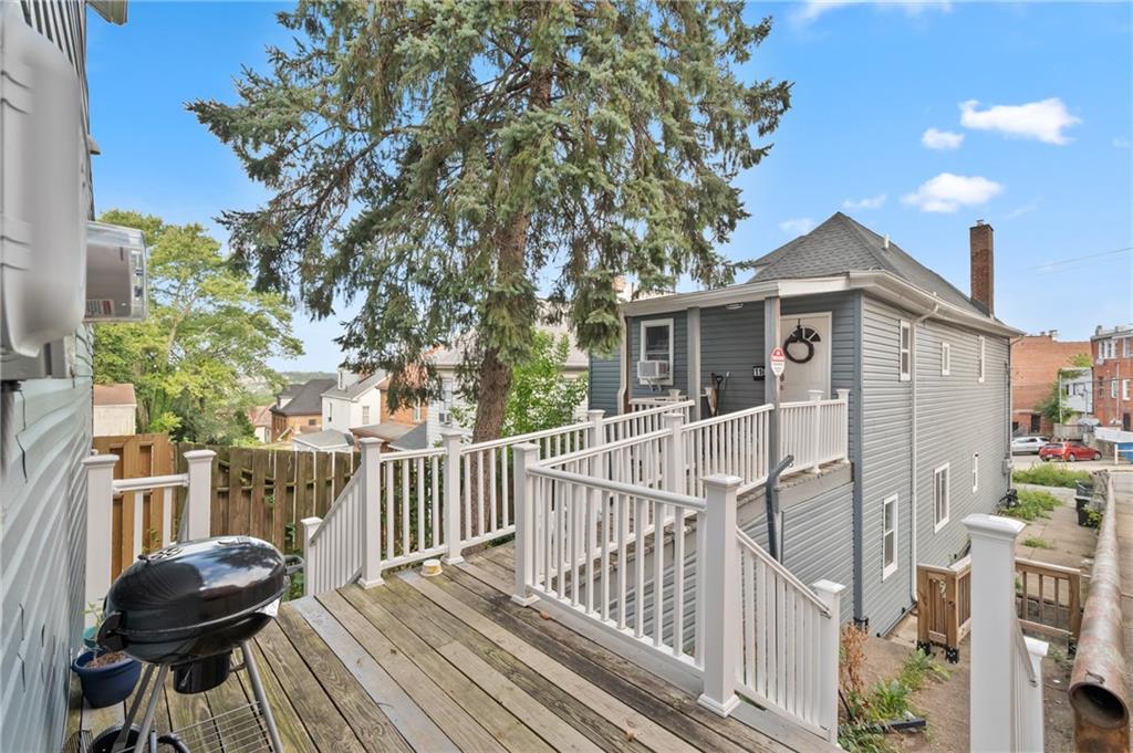11 Maytide Street Pittsburgh, PA 15227 - Photo 5 of 8 a view of a house with wooden deck and furniture