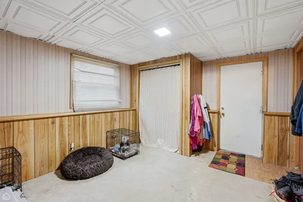 a bed room with a bed and a large window