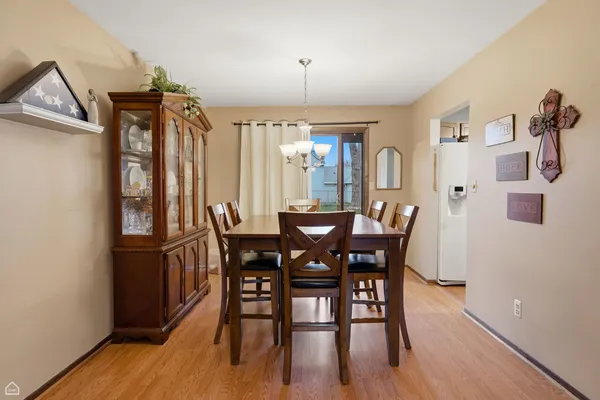 a view of a dining room with furniture and window
