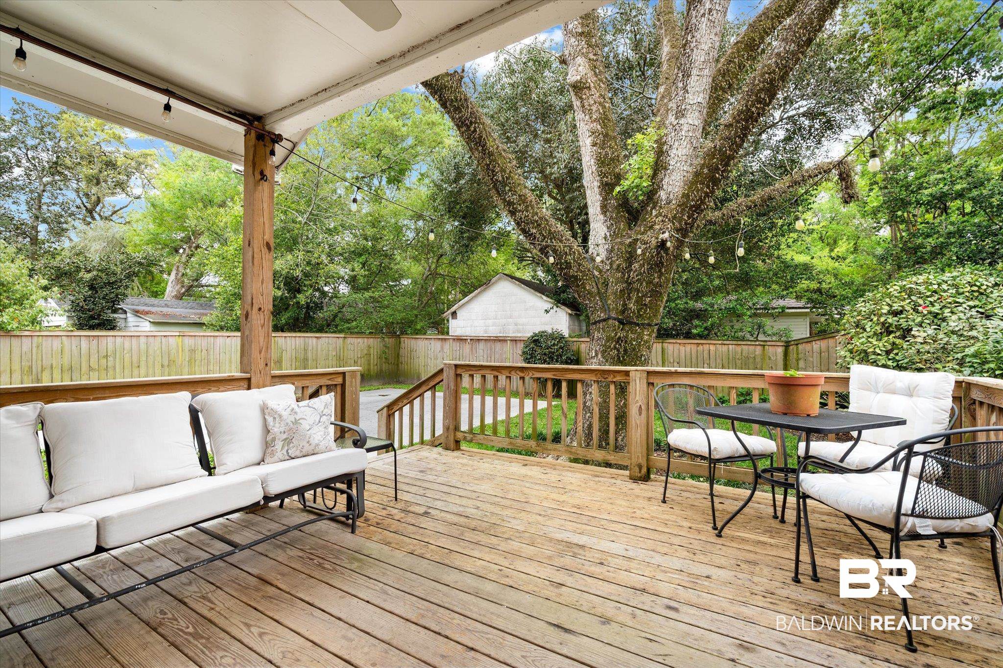 112 Crenshaw Street Mobile, AL 36606 - Photo 18 of 21 Wooden terrace with a fenced backyard and an outdoor hangout area