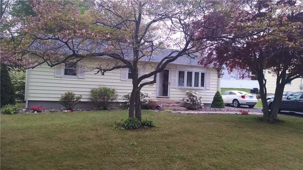 684 Merwin Avenue Milford, CT 06460 - Photo 1 of 1 a front view of house with yard and green space