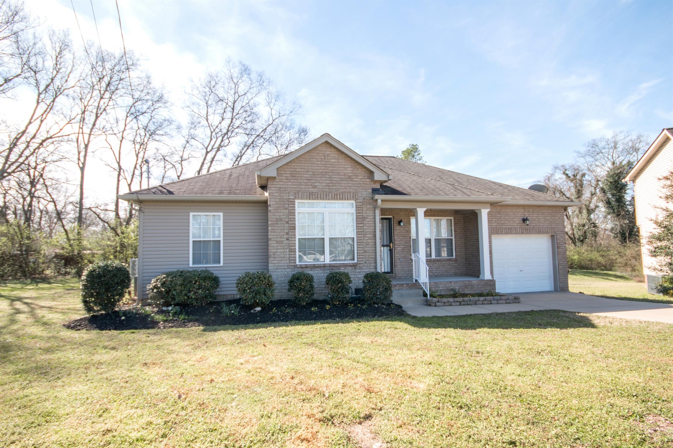 560 Rothwood Avenue Madison, TN 37115 - Photo 1 of 28 a front view of a house with a yard