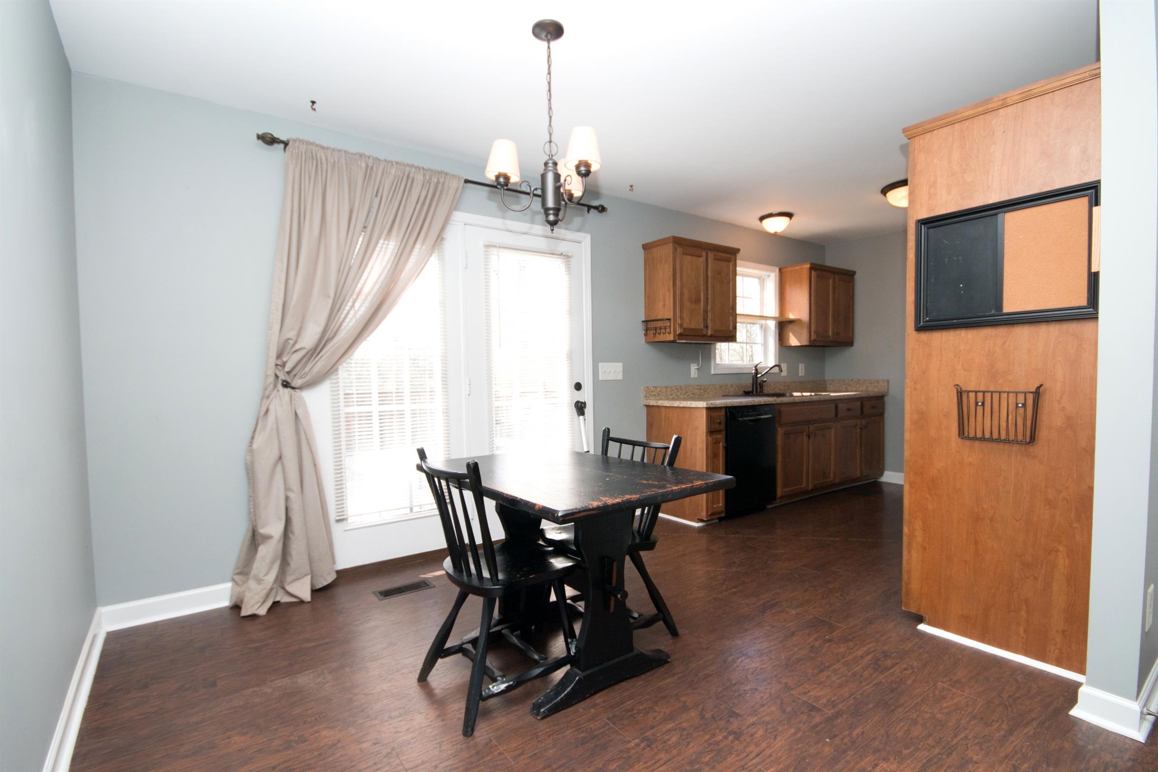 560 Rothwood Avenue Madison, TN 37115 - Photo 14 of 28 a view of a dining room with furniture and a chandelier