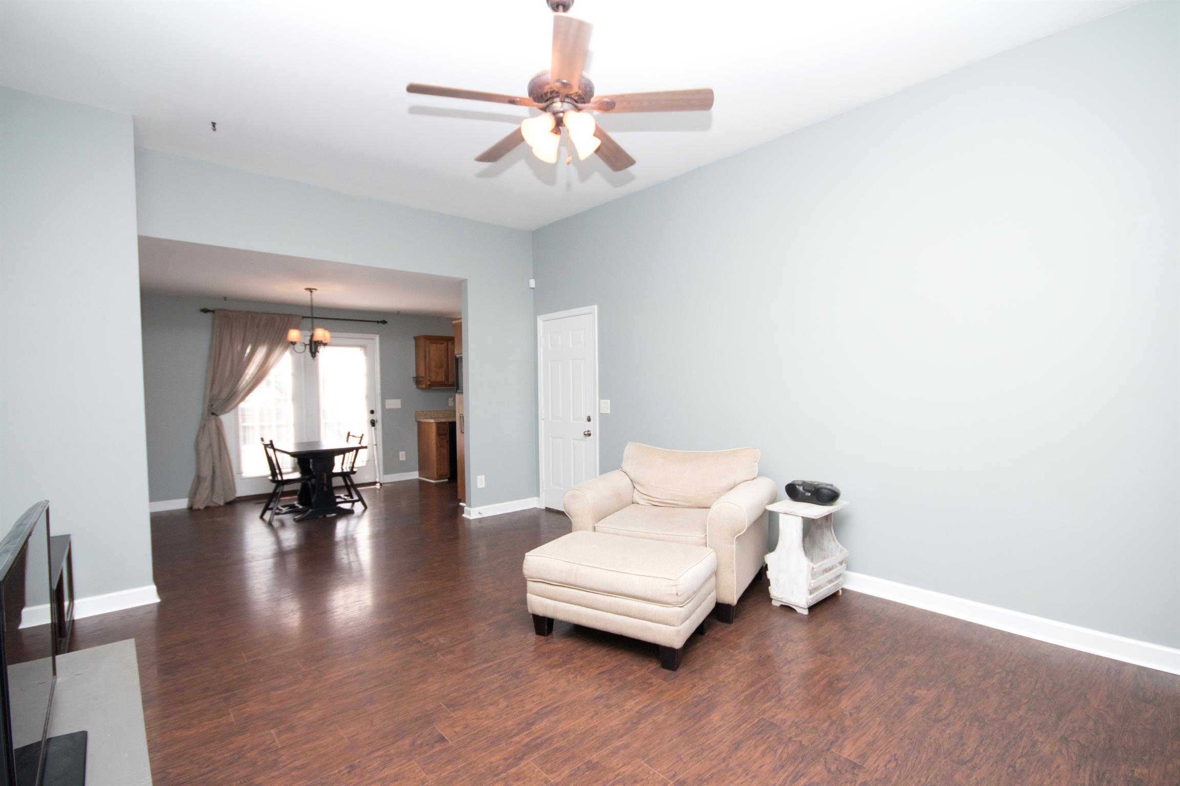 560 Rothwood Avenue Madison, TN 37115 - Photo 4 of 28 a living room with furniture and a chandelier