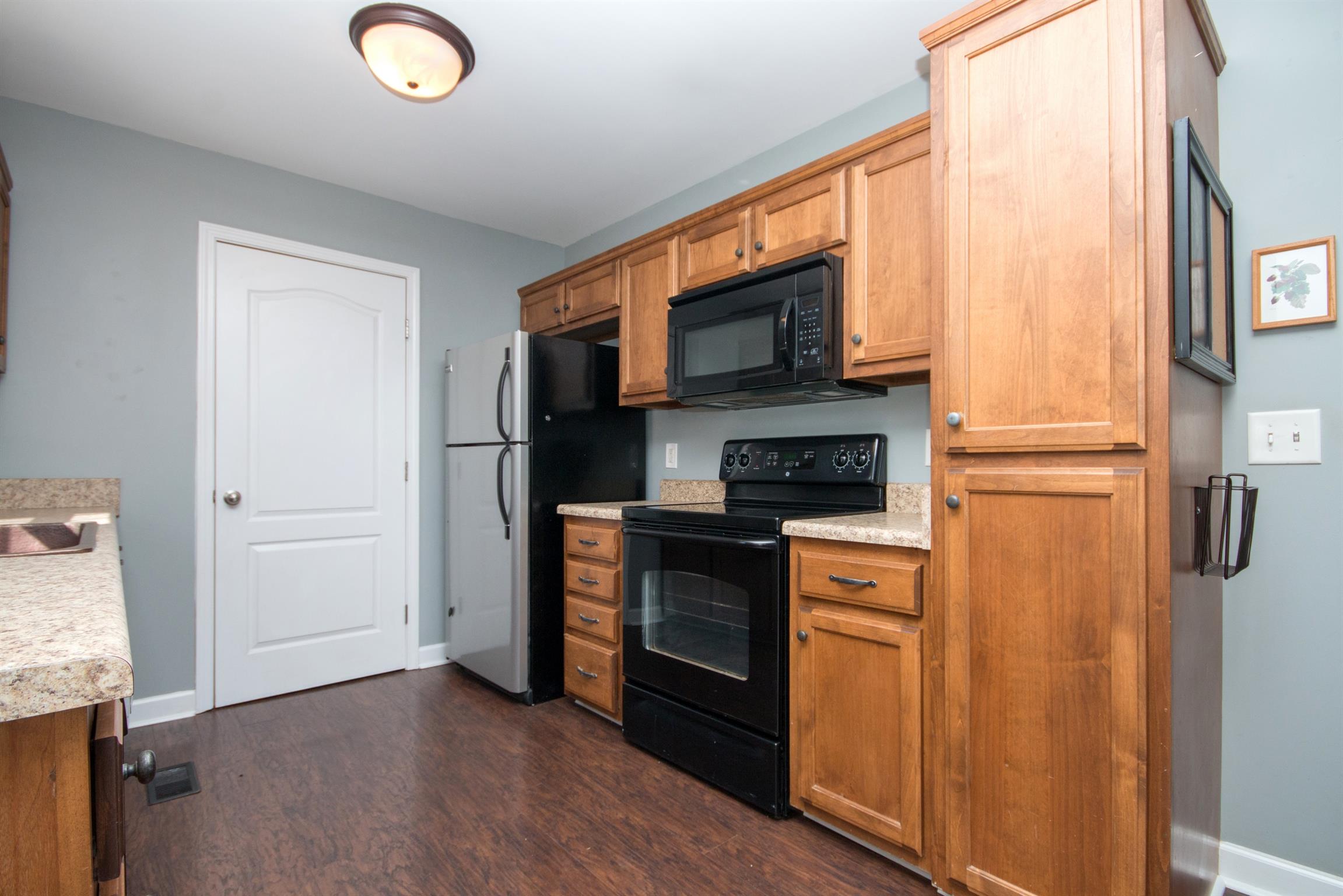 560 Rothwood Avenue Madison, TN 37115 - Photo 10 of 28 a kitchen with stainless steel appliances granite countertop a refrigerator a stove top oven a sink and dishwasher