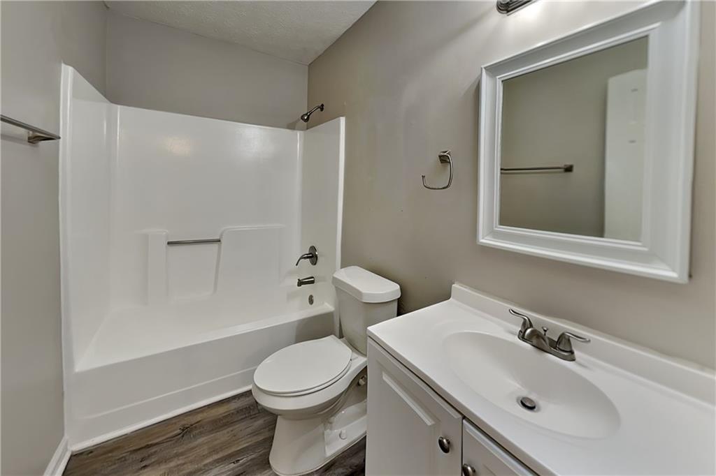 40 Arbor Way Dallas, GA 30157 - Photo 16 of 22 a bathroom with a sink a toilet and shower