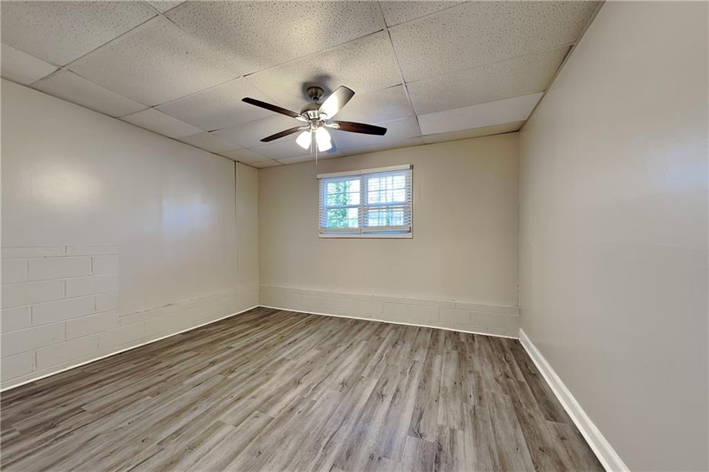 40 Arbor Way Dallas, GA 30157 - Photo 18 of 22 an empty room with wooden floor and windows
