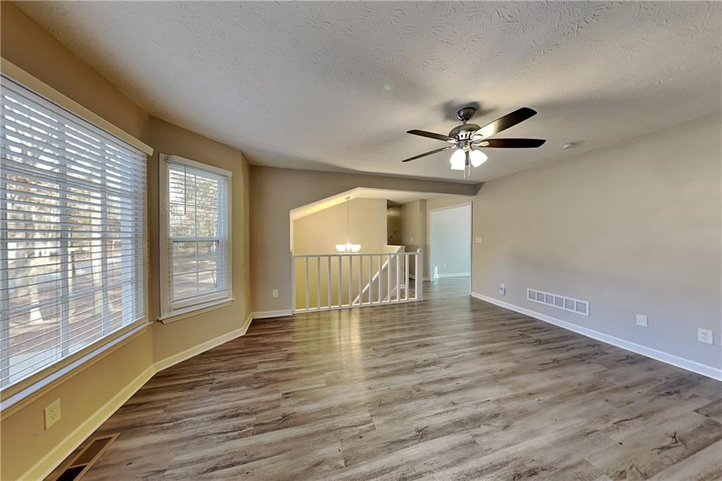 40 Arbor Way Dallas, GA 30157 - Photo 2 of 22 a view of an empty room with window and wooden floor