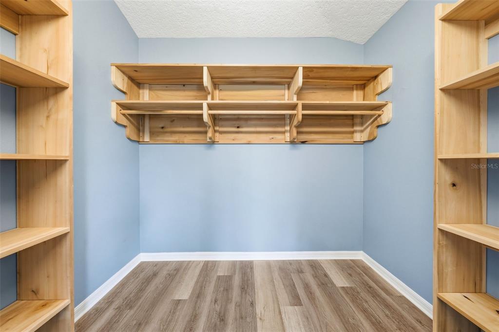 14433 Lake Yale Road Umatilla, FL 32784 - Photo 13 of 38 a view of a room with a wooden floor and a window