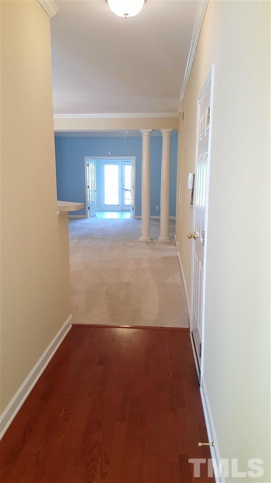 2513 Forest Shadows Lane Raleigh, NC 27614 - Photo 2 of 24 an empty room with windows