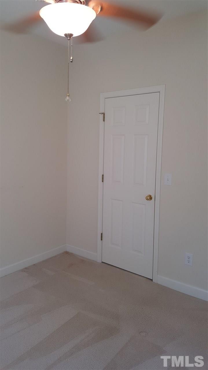 2513 Forest Shadows Lane Raleigh, NC 27614 - Photo 11 of 24 an empty room with a fan