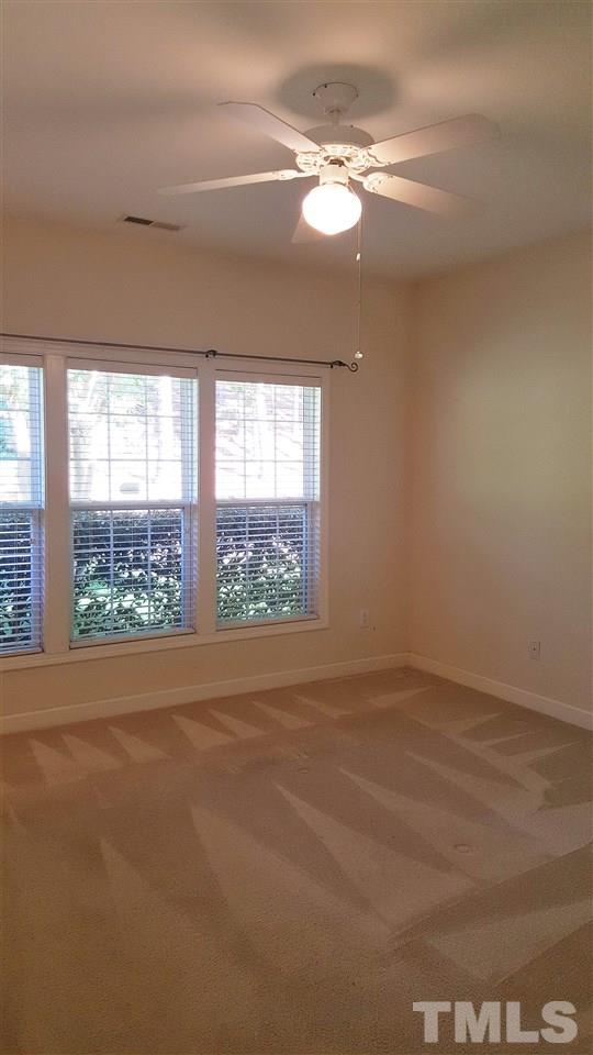 2513 Forest Shadows Lane Raleigh, NC 27614 - Photo 16 of 24 a view of an empty room with a window