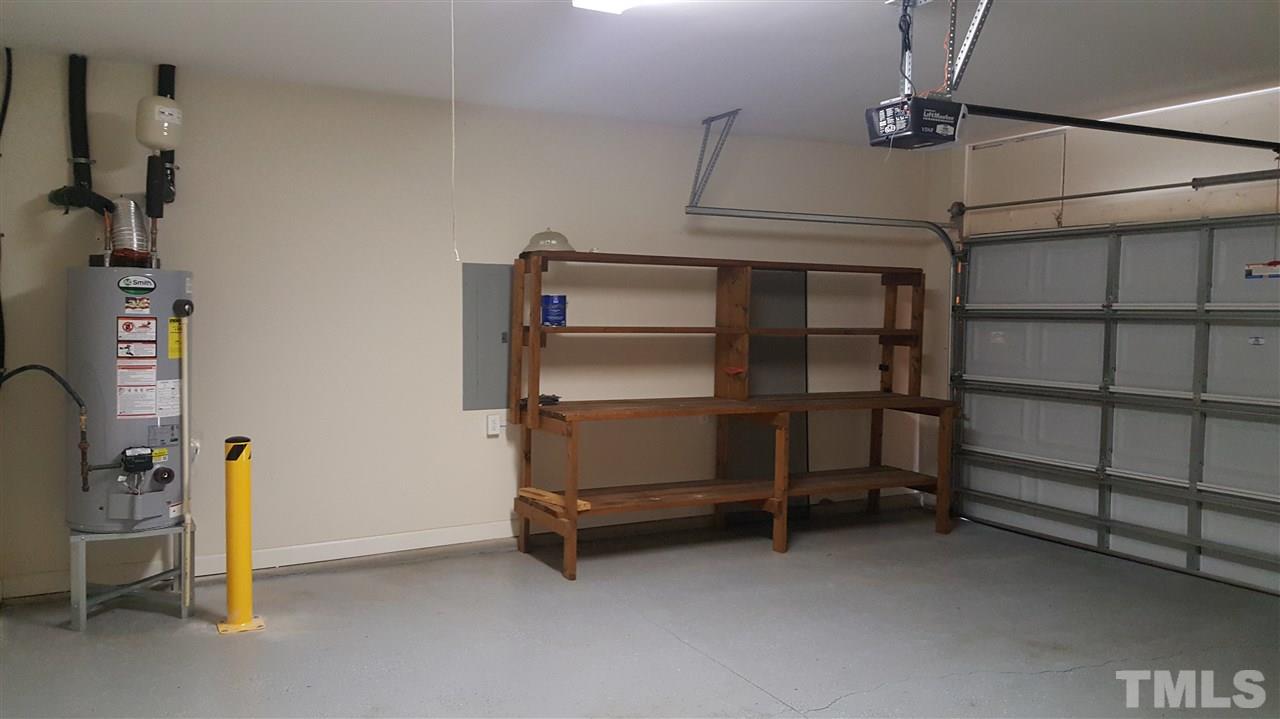 2513 Forest Shadows Lane Raleigh, NC 27614 - Photo 20 of 24 a view of room with racks on the wall