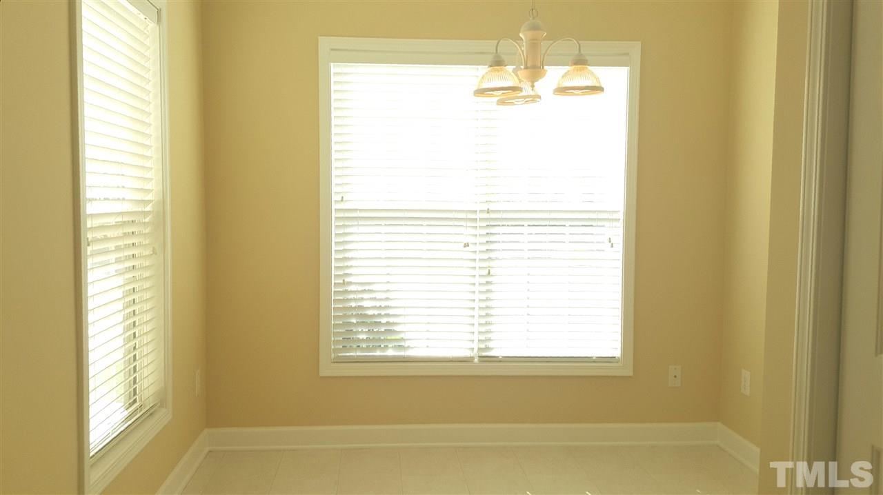 2513 Forest Shadows Lane Raleigh, NC 27614 - Photo 3 of 24 a bathroom with a bathtub next to a window