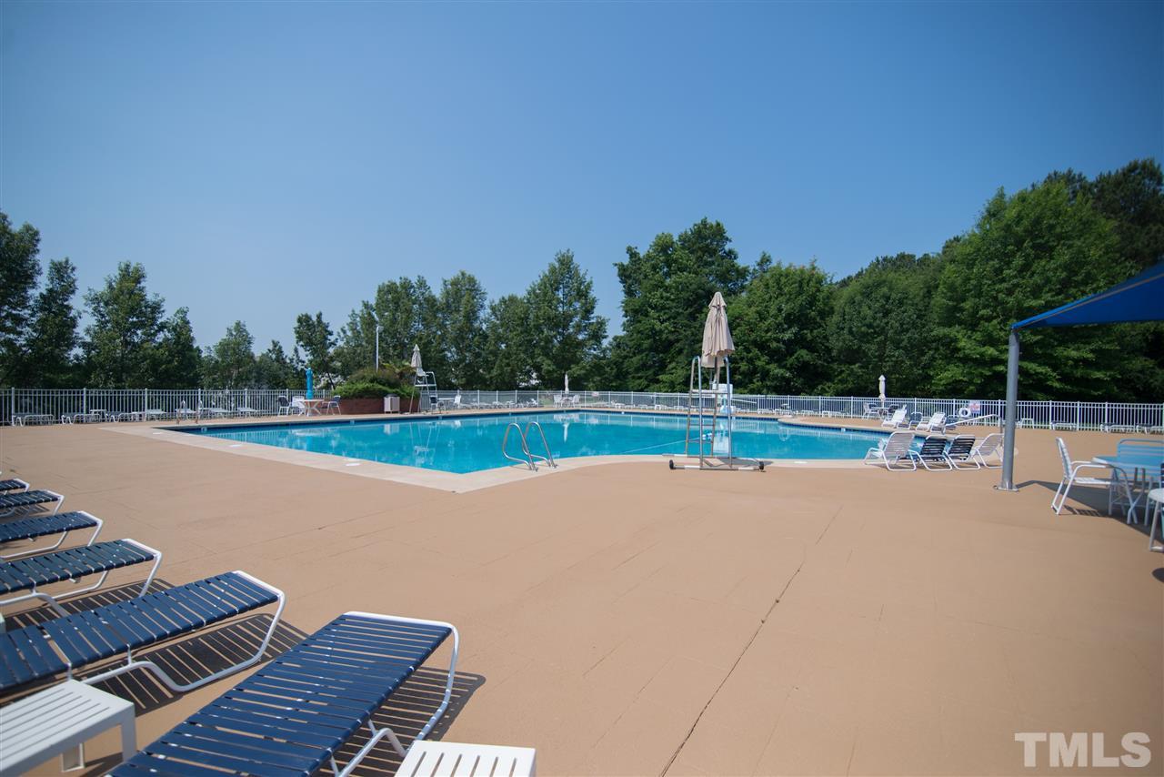 2513 Forest Shadows Lane Raleigh, NC 27614 - Photo 23 of 24 a view of a swimming pool with a yard