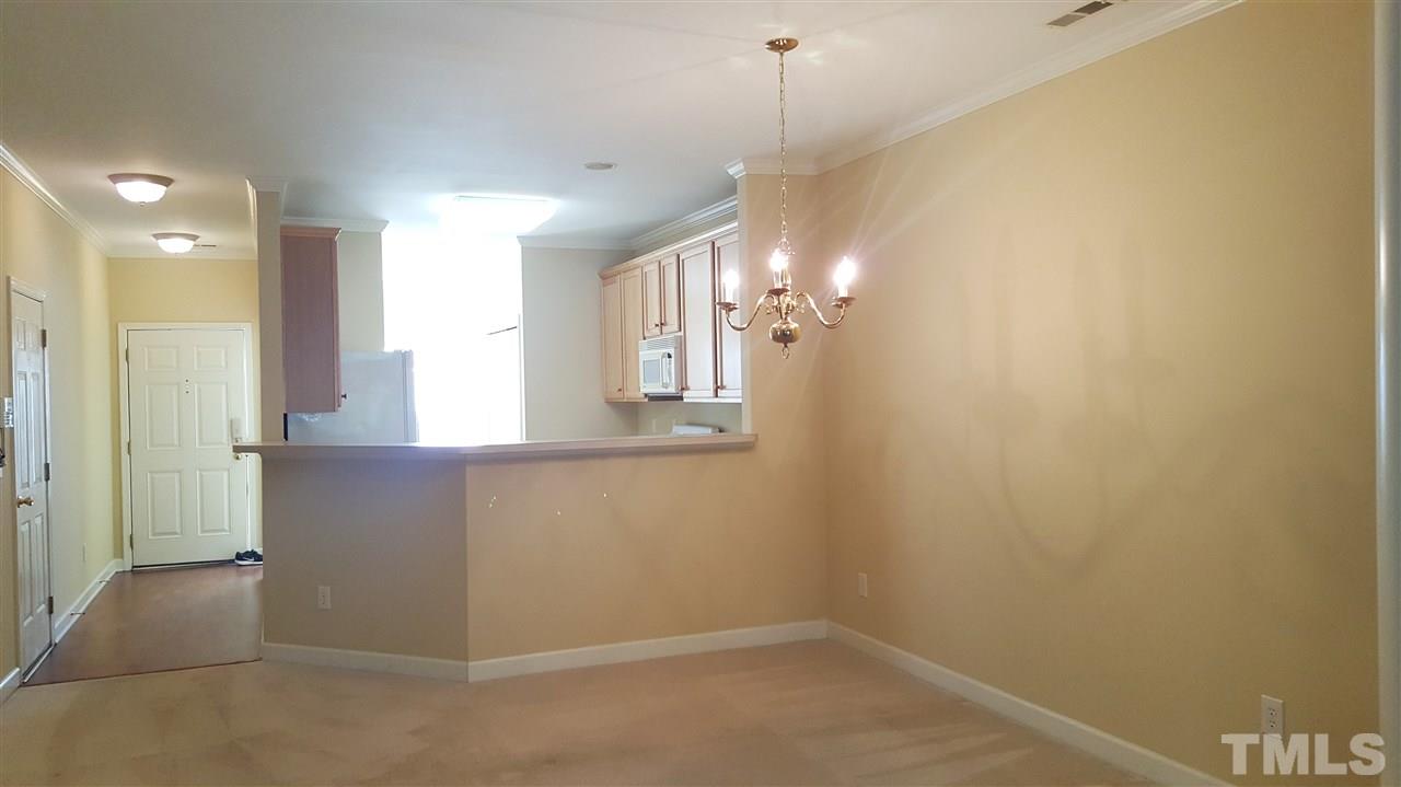 2513 Forest Shadows Lane Raleigh, NC 27614 - Photo 6 of 24 wooden floor in an empty room with a window