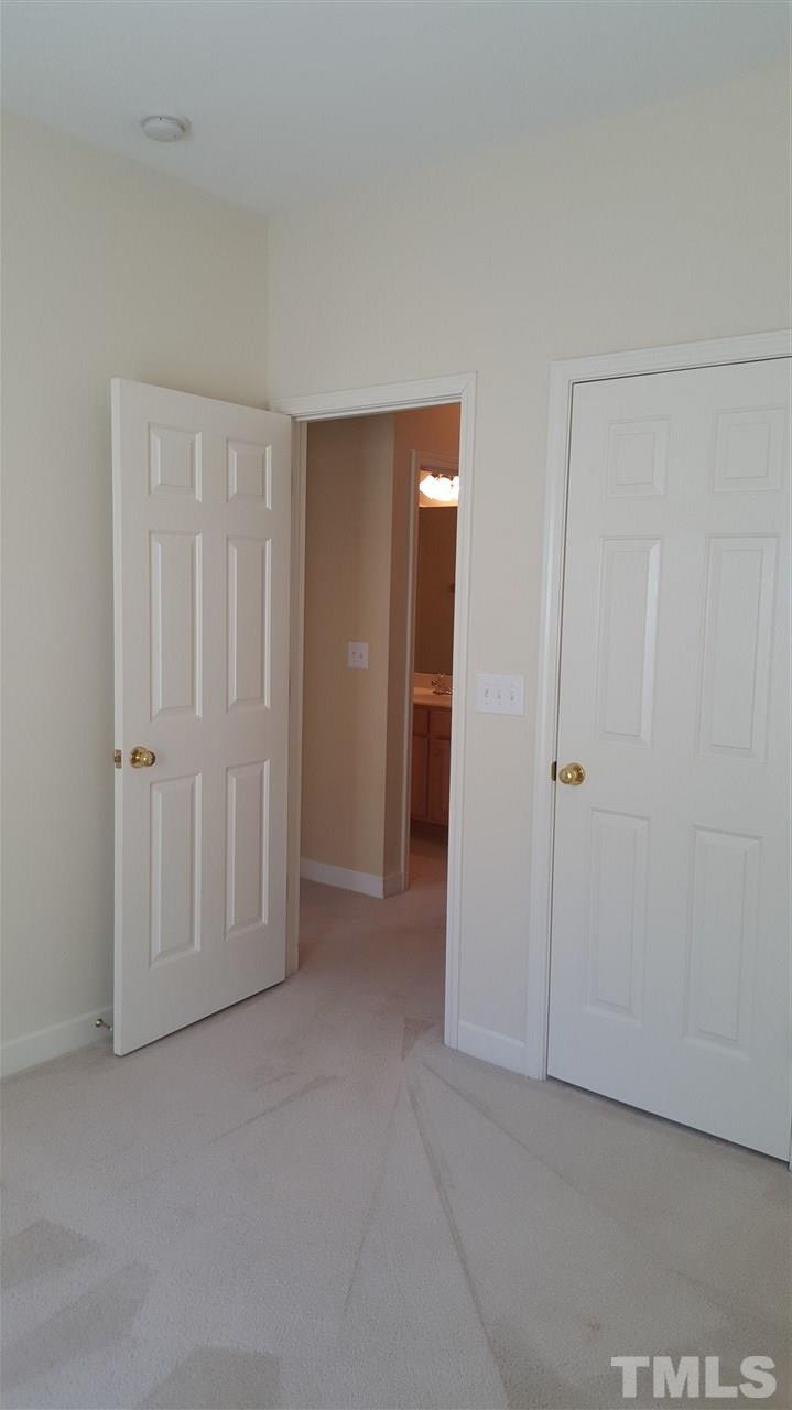 2513 Forest Shadows Lane Raleigh, NC 27614 - Photo 8 of 24 an empty room with closet area