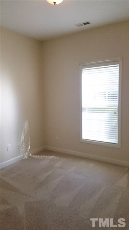 2513 Forest Shadows Lane Raleigh, NC 27614 - Photo 9 of 24 a view of an empty room and a window