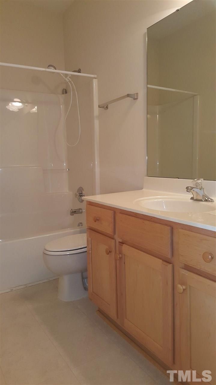2513 Forest Shadows Lane Raleigh, NC 27614 - Photo 10 of 24 a bathroom with a sink a toilet and shower