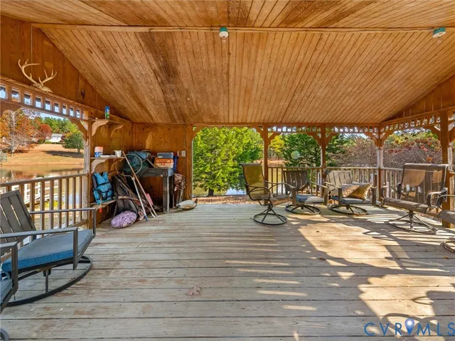 a kitchen with stainless steel appliances granite countertop a refrigerator a stove and a sink with large window