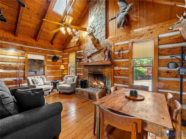 a living room with furniture and a kitchen view