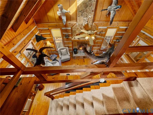 a dirt road with house in the background