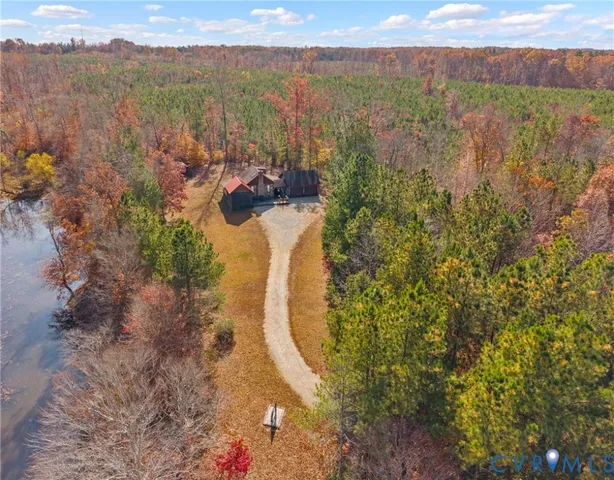 a view of a porch with a floor to ceiling window next to a yard