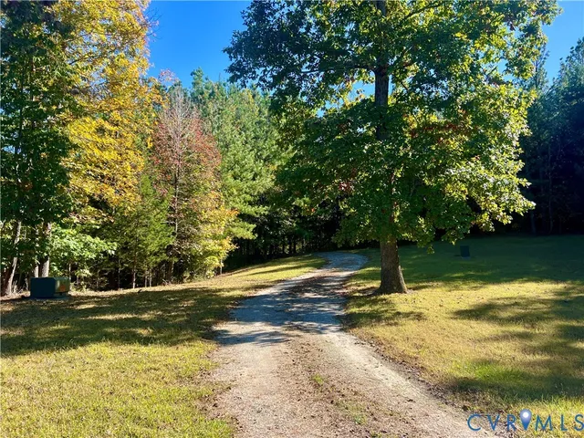 a living room with furniture a fireplace and a table