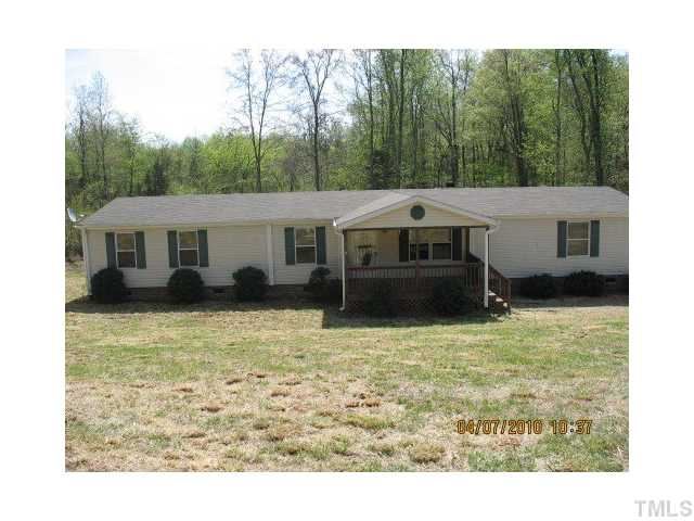 167 Community Road Roxboro, NC 27573 - Photo 1 of 4 a view of a house with a yard
