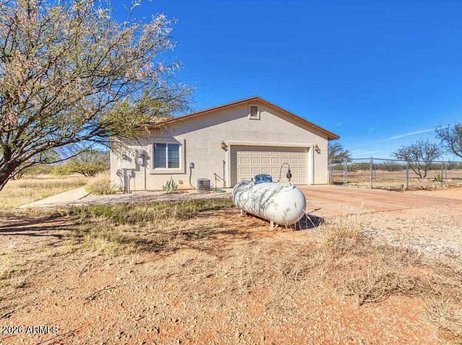 10193 East Windtalker Road Hereford, AZ 85615 - Photo 24 of 34 a front view of a house with a yard