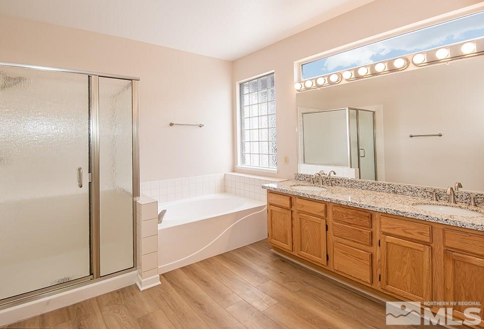 245 Falling Water Court Reno, NV 89519 - Photo 13 of 20 a spacious bathroom with a tub sink and mirror