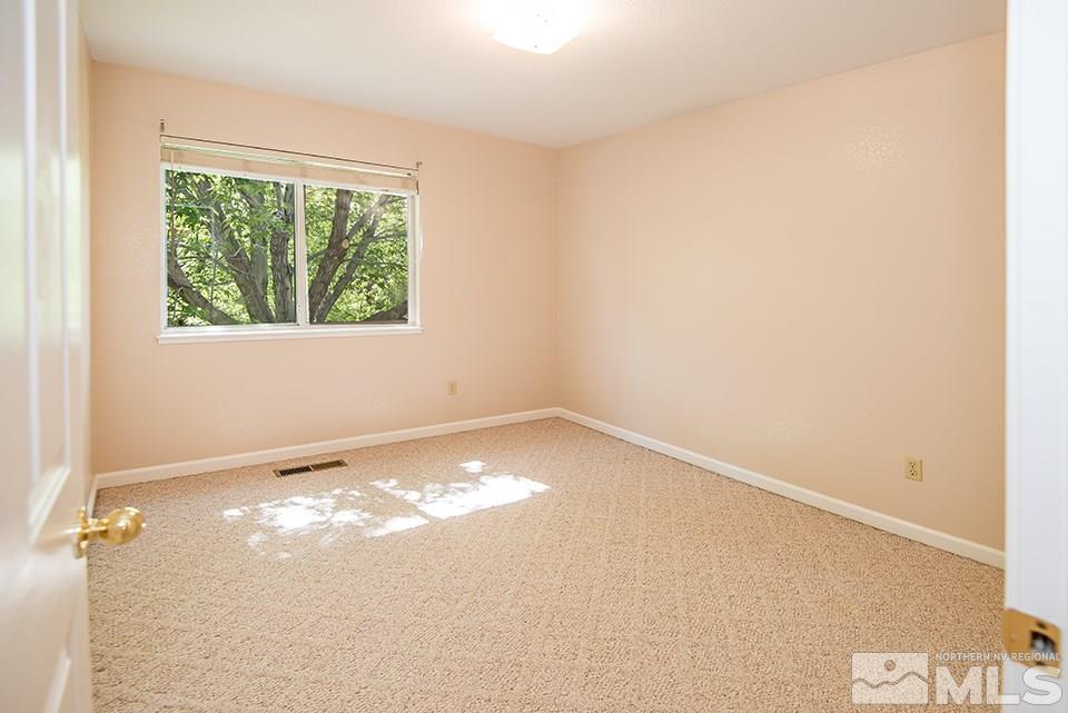 245 Falling Water Court Reno, NV 89519 - Photo 15 of 20 an empty room with a window