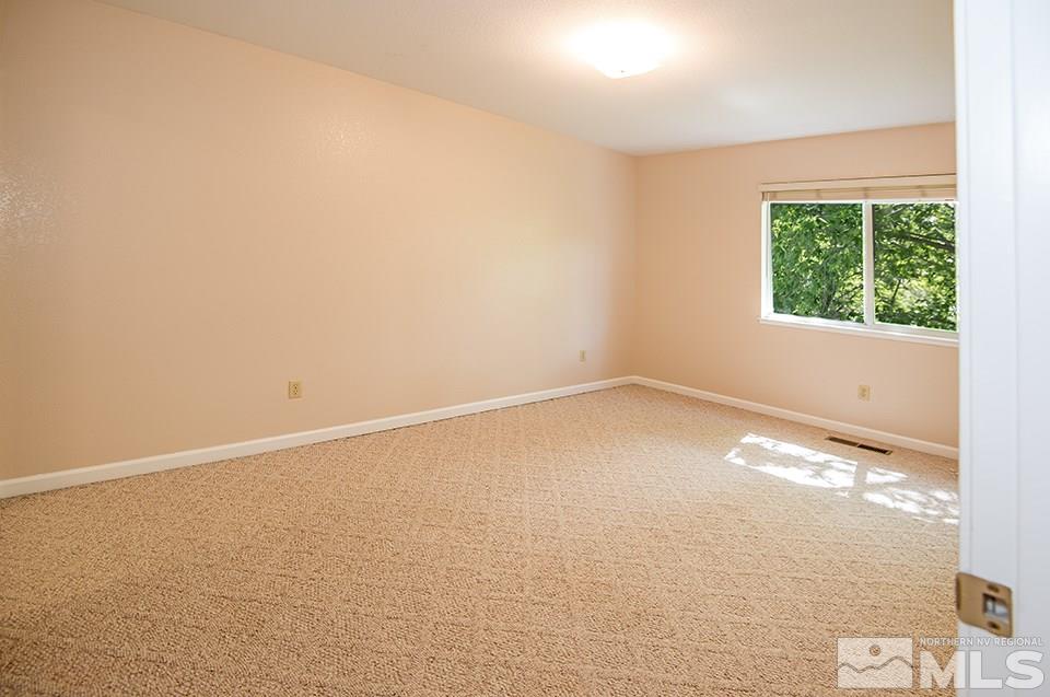 245 Falling Water Court Reno, NV 89519 - Photo 16 of 20 an empty room with a window