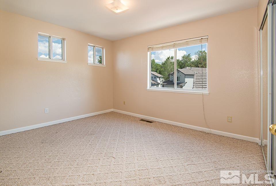 245 Falling Water Court Reno, NV 89519 - Photo 17 of 20 an empty room with a window
