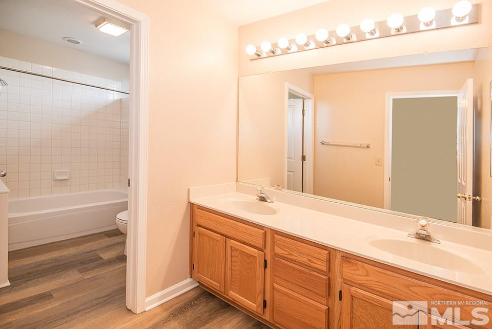 245 Falling Water Court Reno, NV 89519 - Photo 18 of 20 a bathroom with a tub sink and mirror