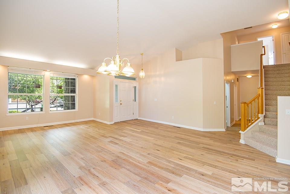 245 Falling Water Court Reno, NV 89519 - Photo 6 of 20 a view of empty room with wooden floor and fan