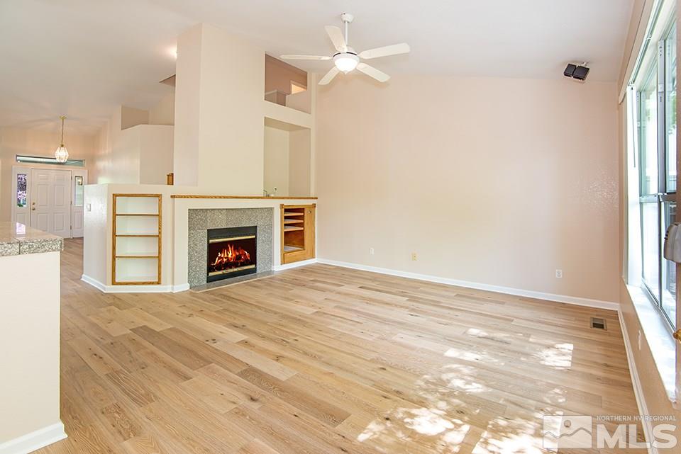 245 Falling Water Court Reno, NV 89519 - Photo 8 of 20 a view of empty room with a fireplace and fan