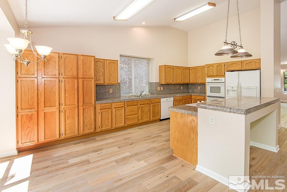 245 Falling Water Court Reno, NV 89519 - Photo 9 of 20 a kitchen with stainless steel appliances granite countertop a sink a stove and a refrigerator