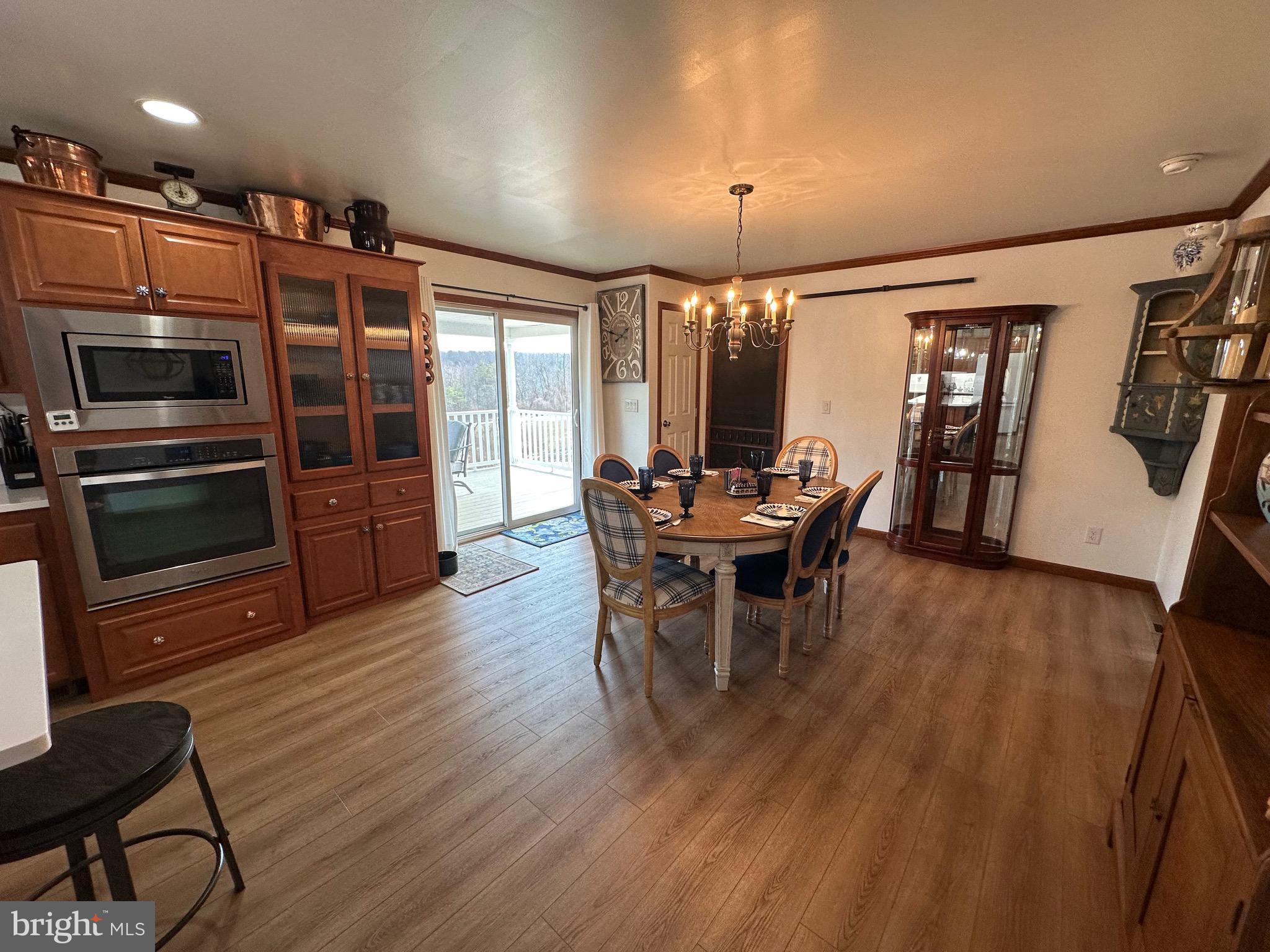 3402 Elk Lick Road Everett, PA 15537 - Photo 11 of 80 a view of a dining room with furniture window and wooden floor