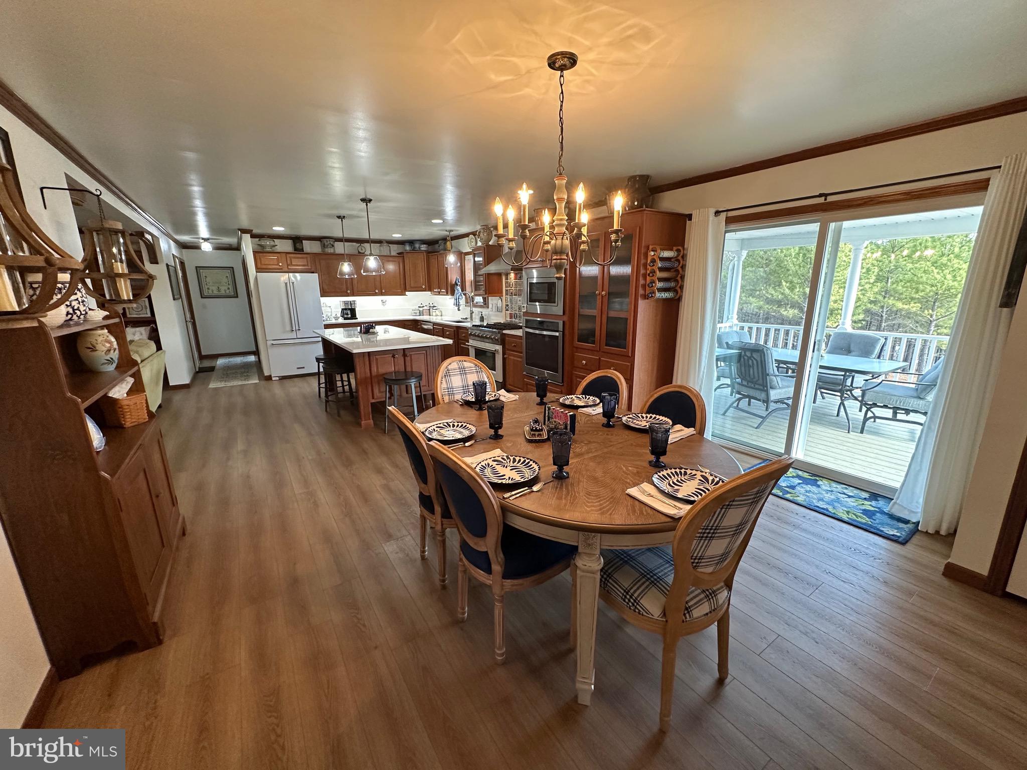 3402 Elk Lick Road Everett, PA 15537 - Photo 13 of 80 a view of a dining room with furniture window and wooden floor