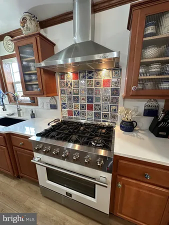 a kitchen with a sink and a window