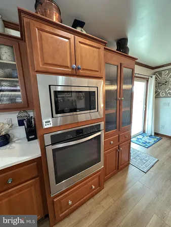 a bathroom with a sink a shower and a stove