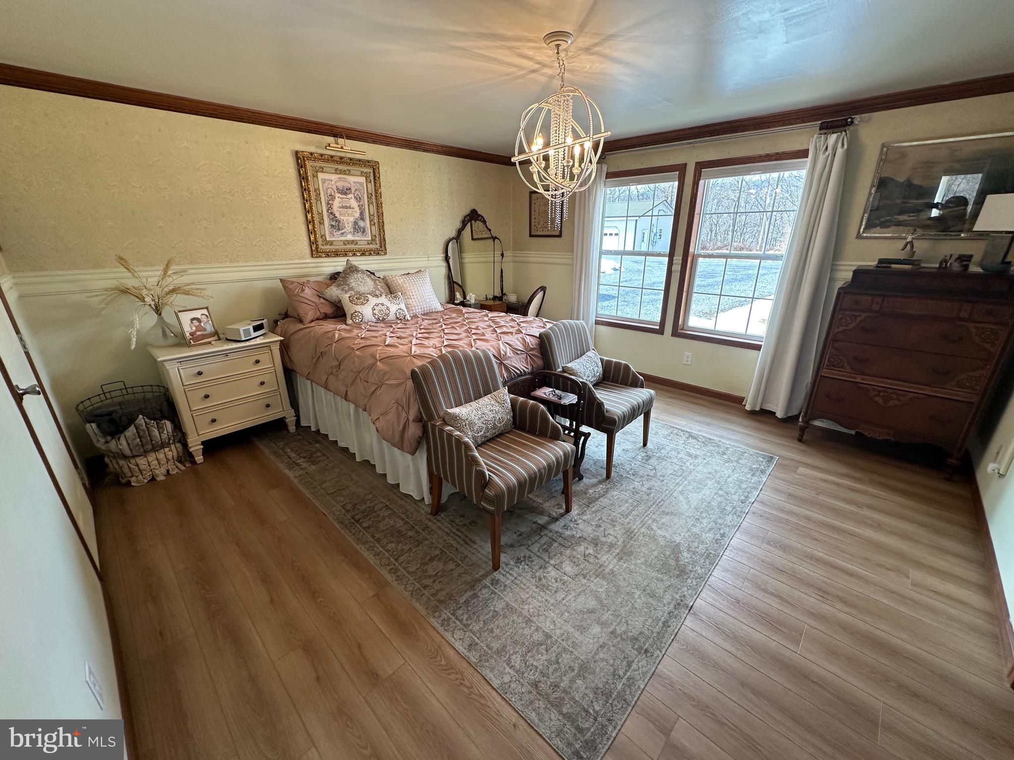3402 Elk Lick Road Everett, PA 15537 - Photo 21 of 80 a bedroom with a bed couch chandelier and a window