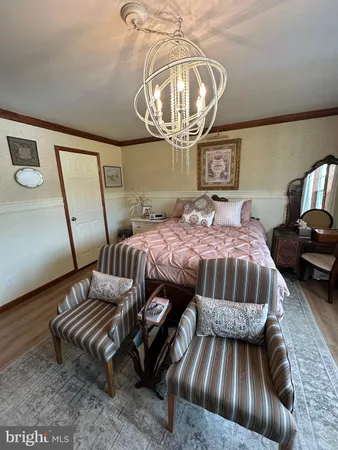 a bathroom with a toilet sink and shower curtain
