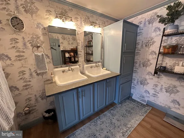 a bedroom with a bed next to a large window