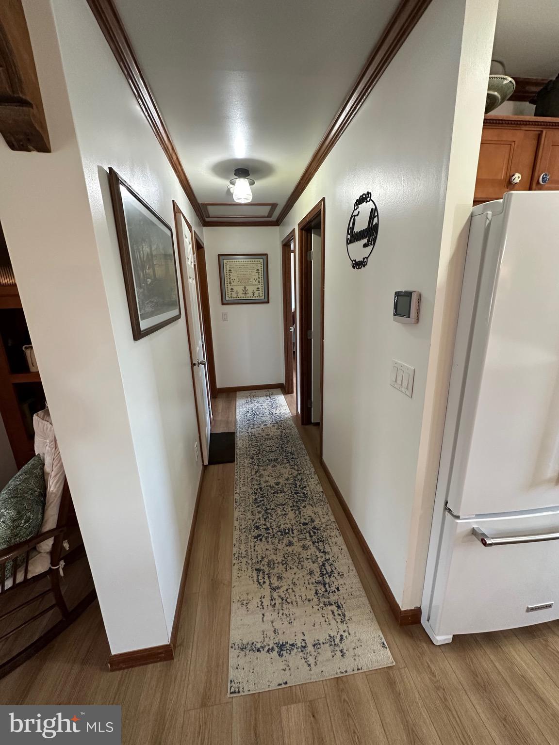 3402 Elk Lick Road Everett, PA 15537 - Photo 32 of 80 a view of a hallway with wooden floor and stairs