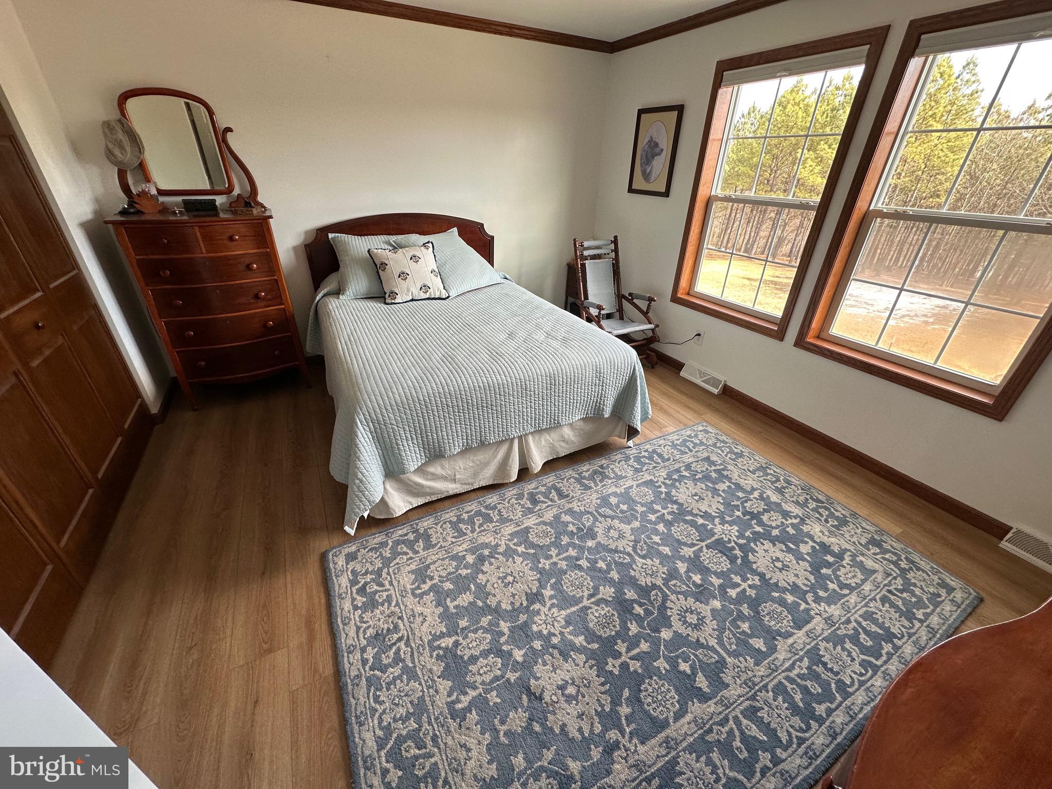 3402 Elk Lick Road Everett, PA 15537 - Photo 33 of 80 a bedroom with a bed next to a large window