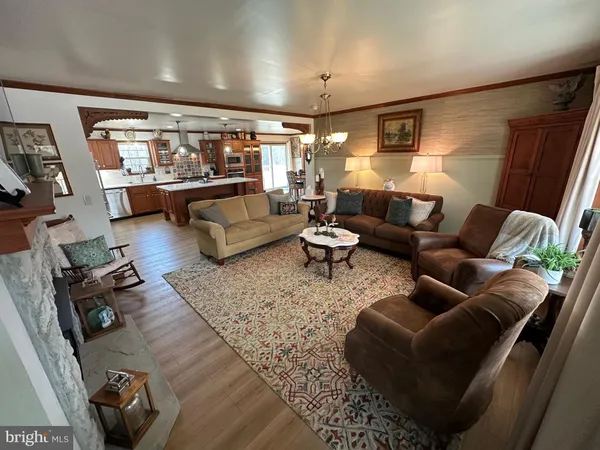 a living room with furniture fireplace and a flat screen tv