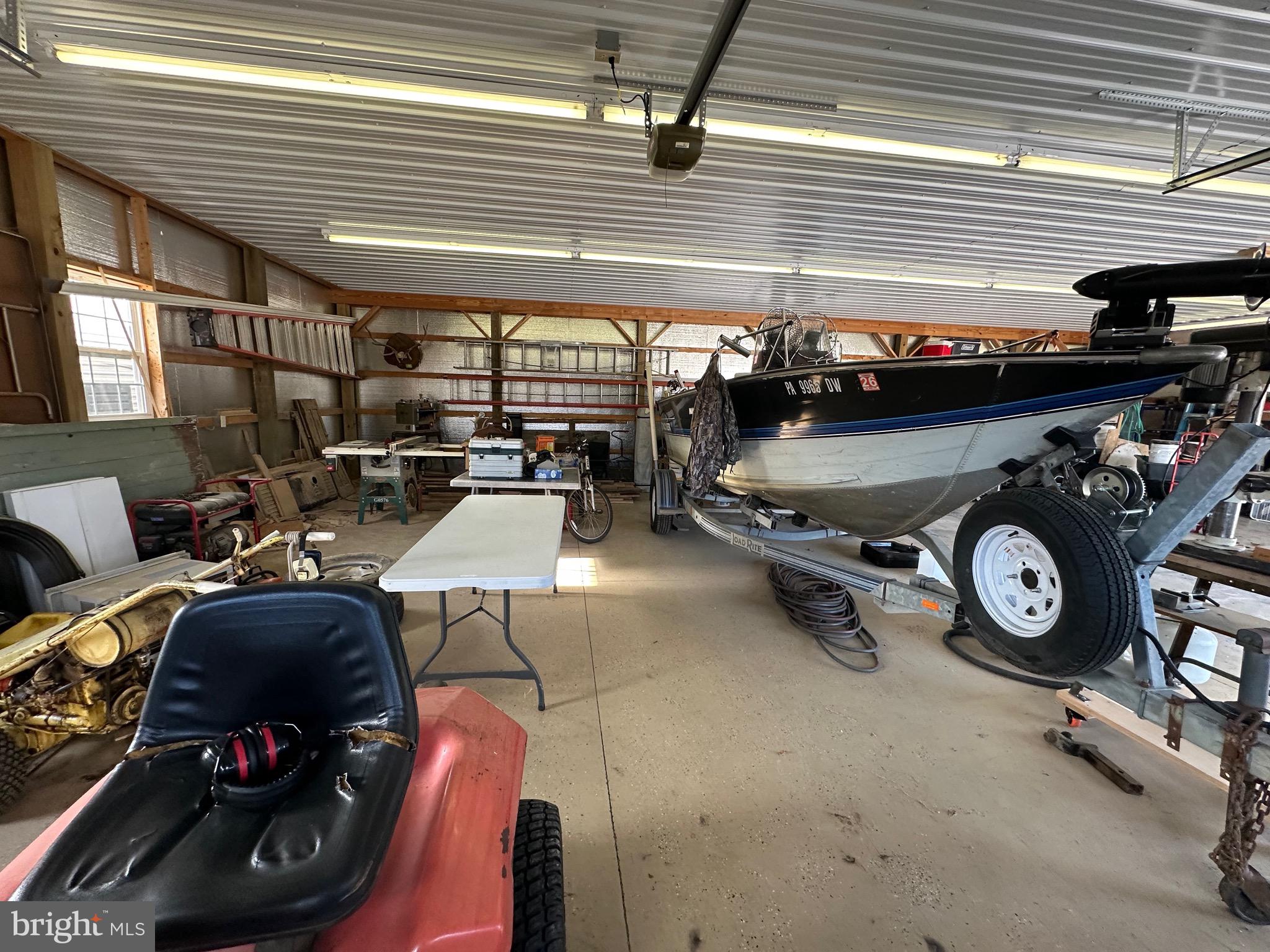 3402 Elk Lick Road Everett, PA 15537 - Photo 51 of 80 a car and bike parked in a garage